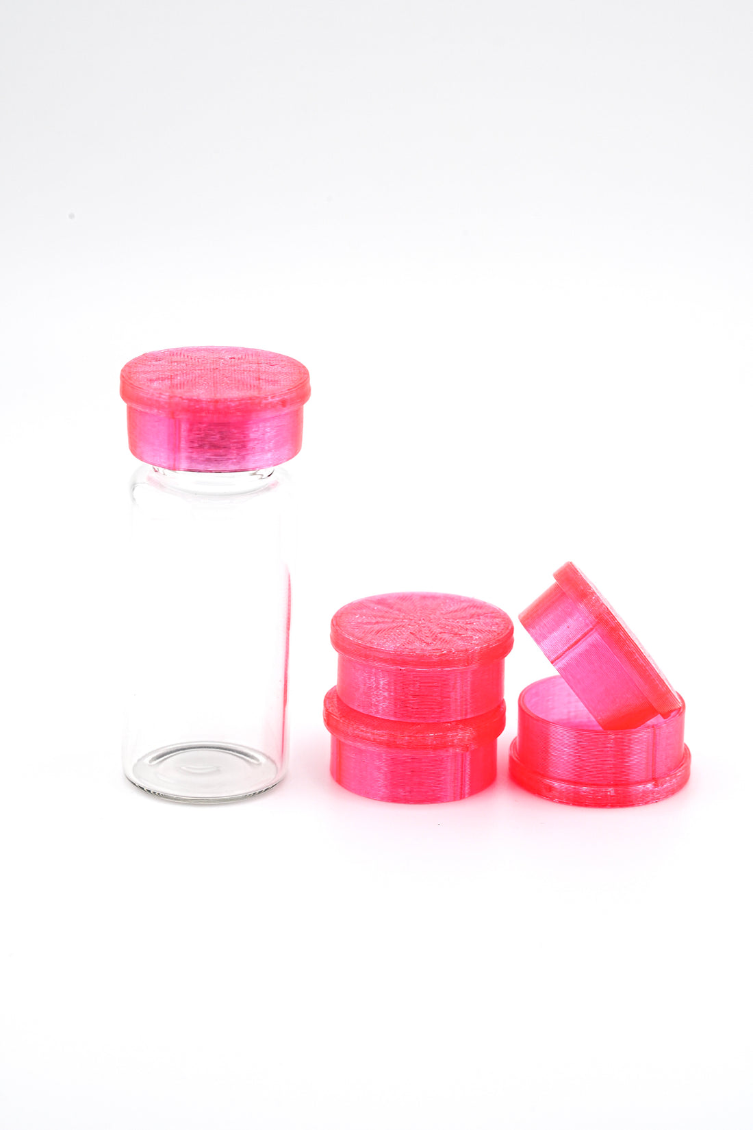 Set of pink bottle caps on a white background