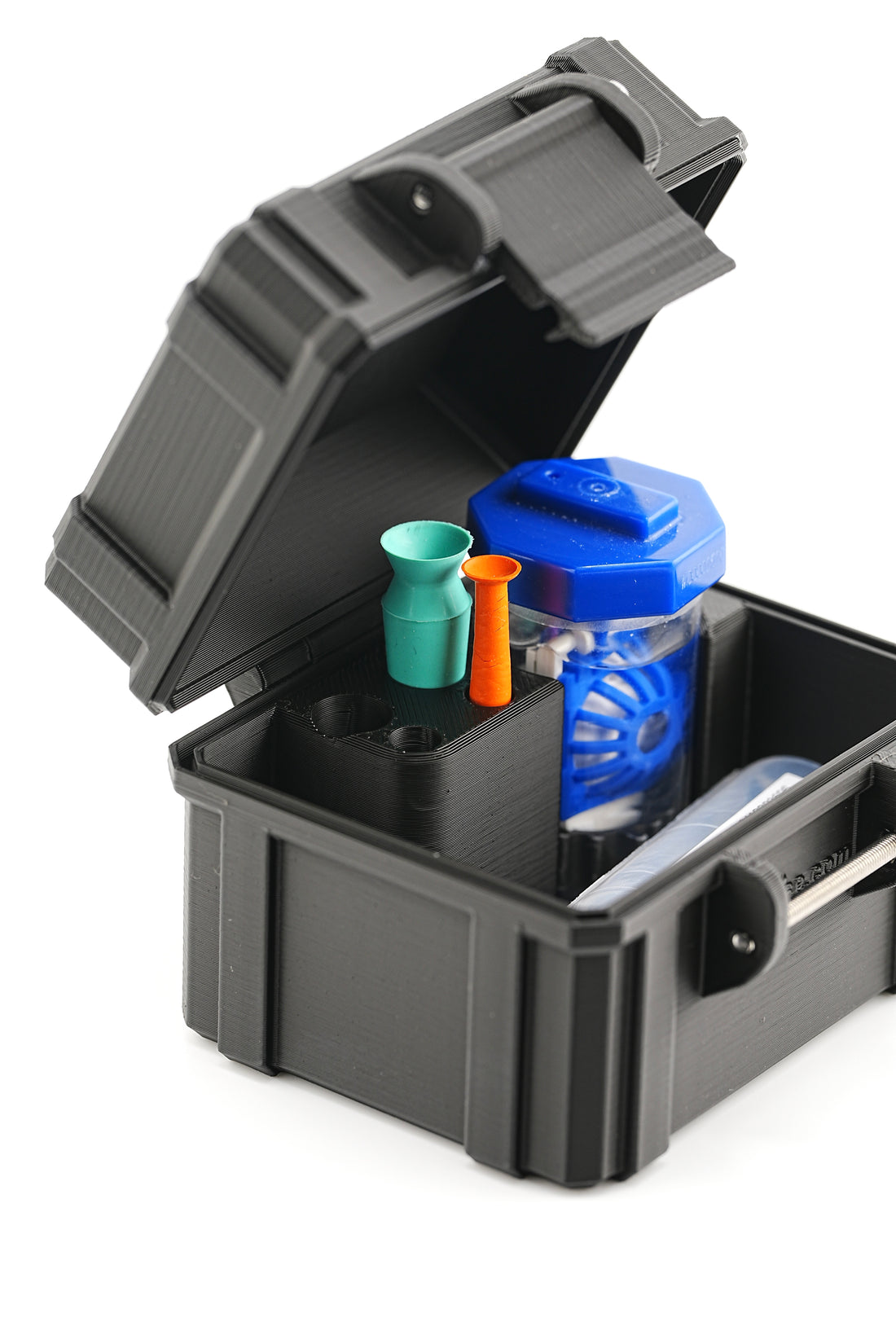 Black storage box with open lid containing colorful items on a white background