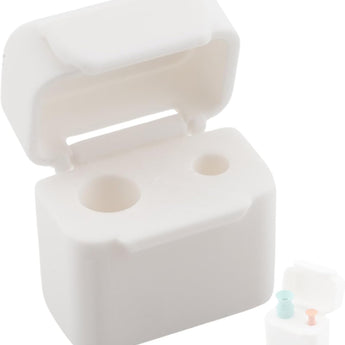 A small white compact storage case for scleral lens tools with a secure latching mechanism, shown open with compartments.
