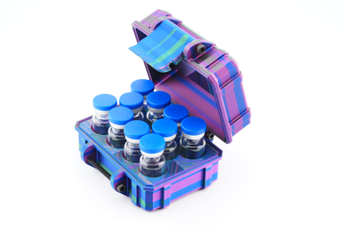 Purple and blue vial case with small bottles and blue caps on a white background