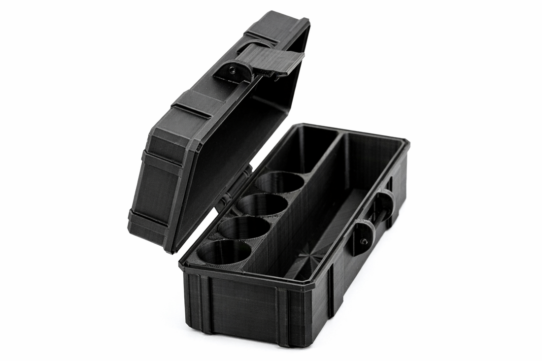 Black plastic vial container with compartments on a white background