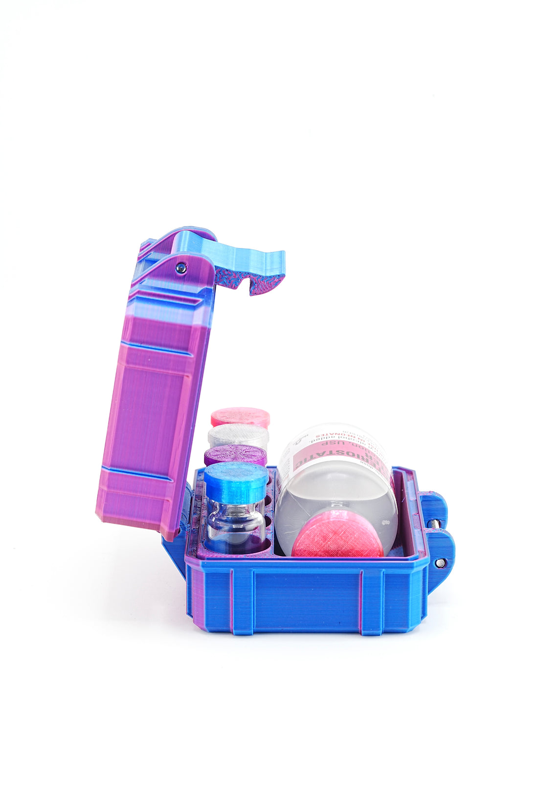 Blue vial case with colorful accessories on a white background