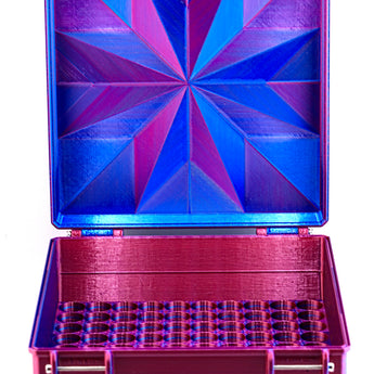Colorful geometric-patterned box with open lid on a white background