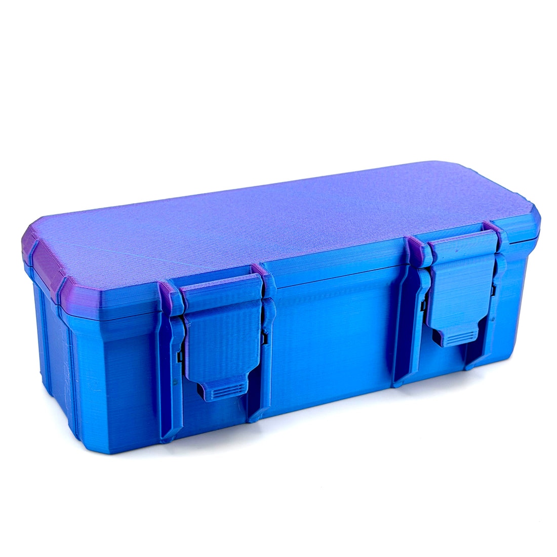 Closed iridescent blue and purple hard-shell vial case with two front latches shown at an angle.