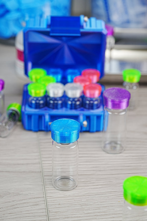 Top places to buy bacteriostatic water — open blue VialCase with multiple peptide vials and an empty vial showing a complete BAC reconstitution kit