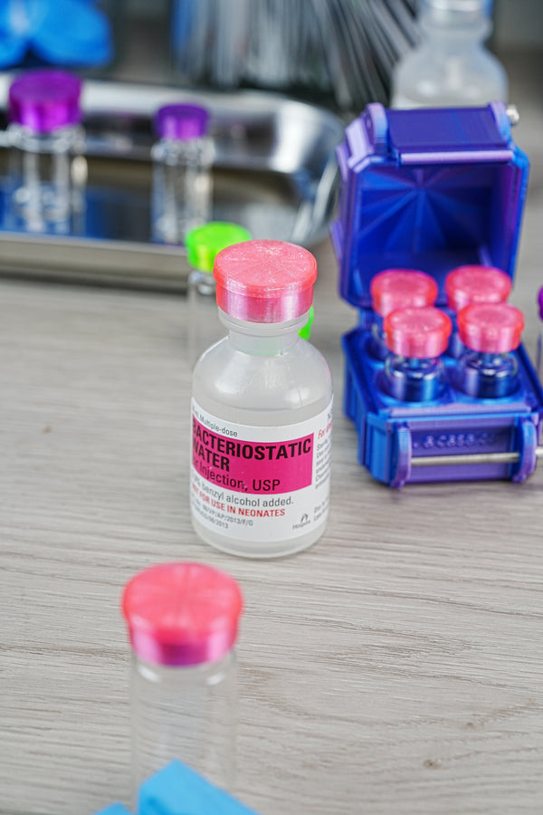 Where to find real bacteriostatic water — close-up of an authentic Hospira BAC water bottle showing the USP label, lot number, and preservative declaration