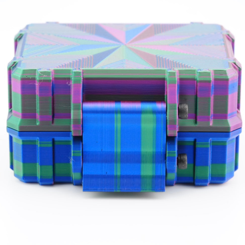 Colorful geometric-patterned suitcase on a white background
