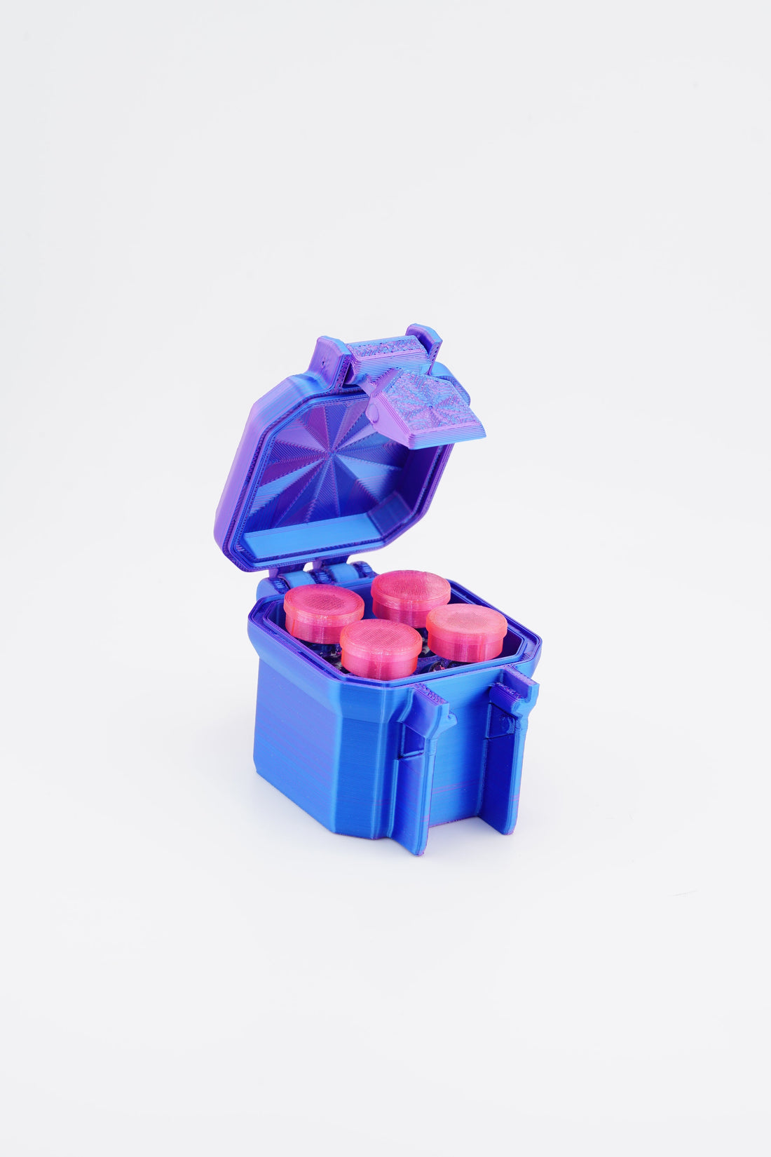 Blue and purple plastic container with pink items on a white background