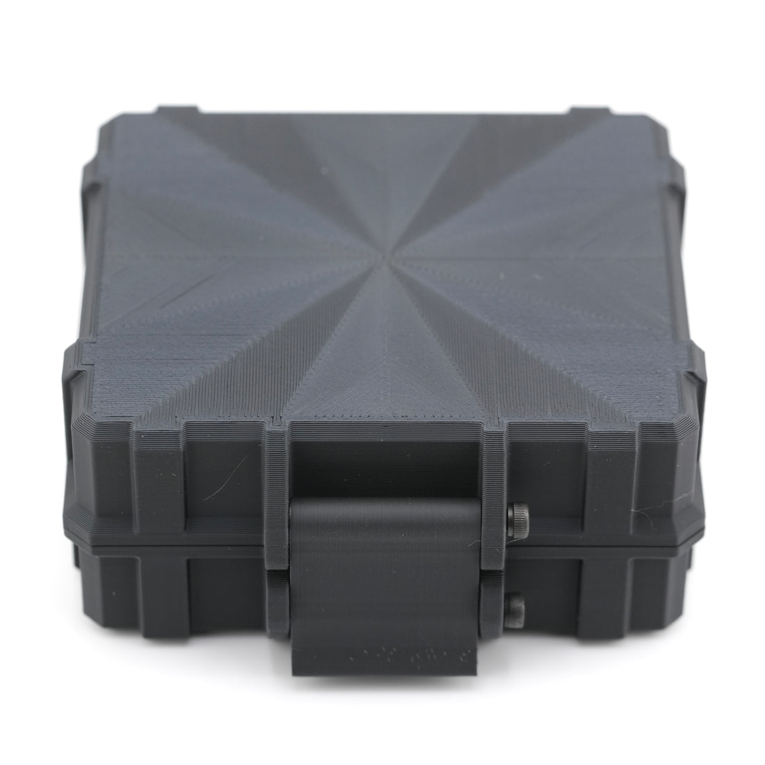 Black plastic case with geometric pattern on a white background