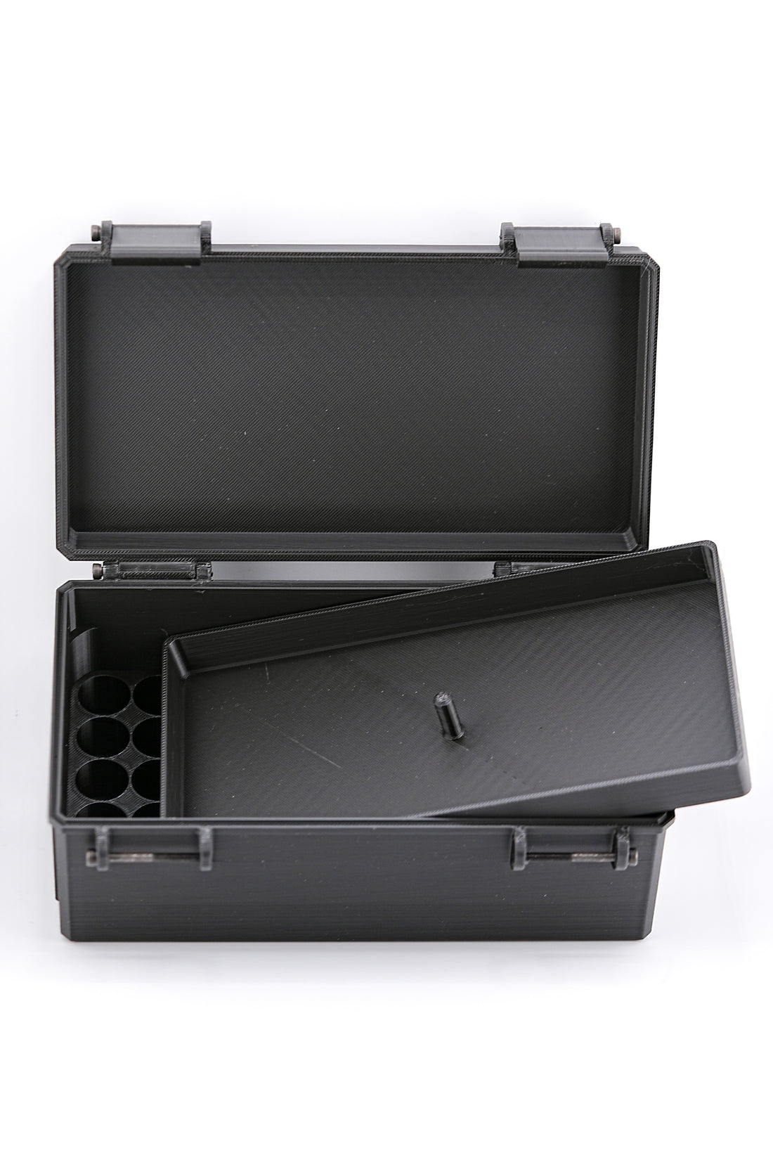 Black plastic tool vial case with open lid on a white background