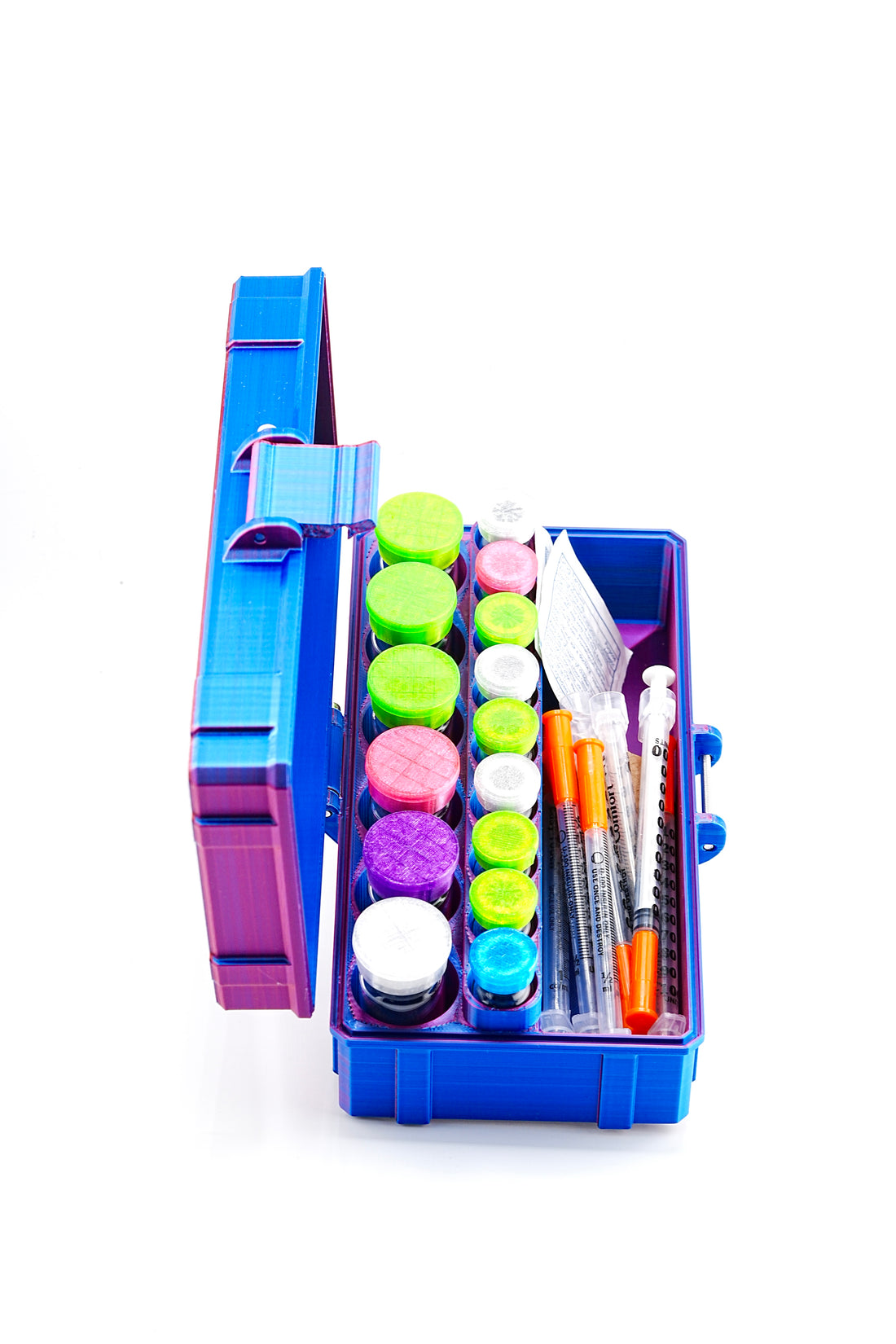 Open blue vial storage case filled with colorful vials and syringes and pads.