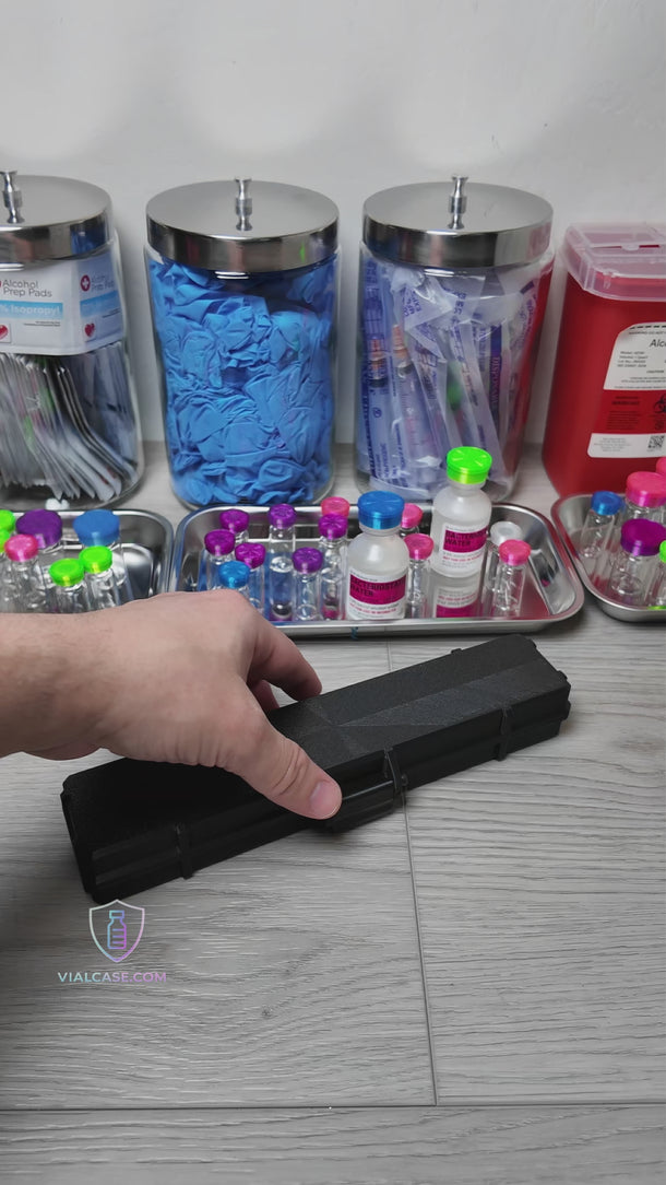 Slim hard-shell case shown opening and closing, designed to hold preloaded syringes. The case is placed into a bag to demonstrate portability and compact size.