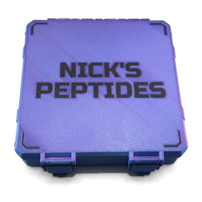 A large RGB Metallic vial case with a customer's name stacked on two lines and corner marks printed into the lid in black